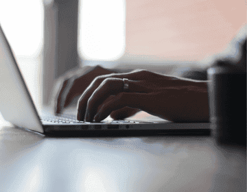 Person typing on laptop